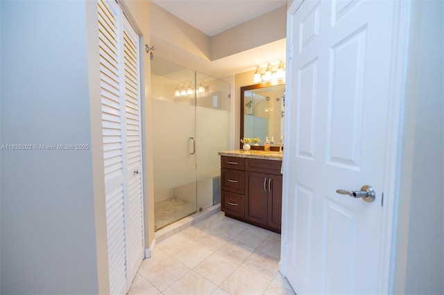 1280 S Alhambra Cir Unit 1310, Coral Gables, FL 33146 - full bath with vanity, a shower stall, a closet, and tile patterned floors