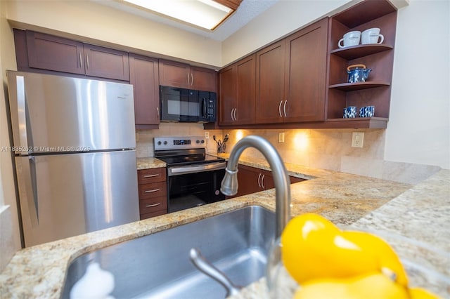 1280 S Alhambra Cir Unit 1310, Coral Gables, FL 33146 - kitchen featuring stainless steel appliances, open shelves, decorative backsplash, and light stone countertops
