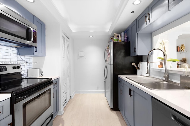 1717 N Bayshore Dr Unit A-3453, Miami, FL 33132 - kitchen with stainless steel appliances, light countertops, backsplash, recessed lighting, and light wood-type flooring