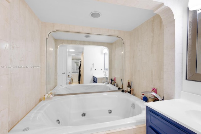 1717 N Bayshore Dr Unit A-3453, Miami, FL 33132 - full bath featuring vanity, a jetted tub, and tile walls