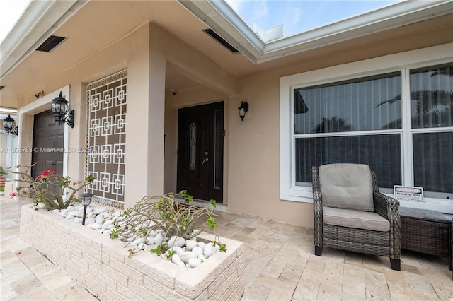 4811 NW 58th St, Tamarac, FL 33319 - doorway to property featuring stucco siding and a patio