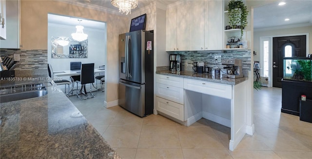4811 NW 58th St, Tamarac, FL 33319 - kitchen with stainless steel refrigerator with ice dispenser, a chandelier, ornamental molding, open shelves, and white cabinets