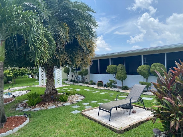 4811 NW 58th St, Tamarac, FL 33319 - view of grassy yard with a sunroom