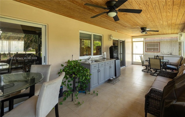 4811 NW 58th St, Tamarac, FL 33319 - view of patio with outdoor dining space, an outdoor kitchen, ceiling fan, and washer / clothes dryer