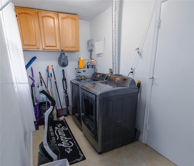 4811 NW 58th St, Tamarac, FL 33319 - laundry area featuring separate washer and dryer, cabinet space, and a textured ceiling
