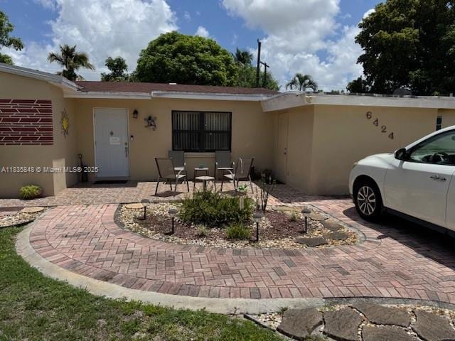6424 SW 20th St, Miramar, FL 33023 - view of front of home featuring stucco siding and a patio