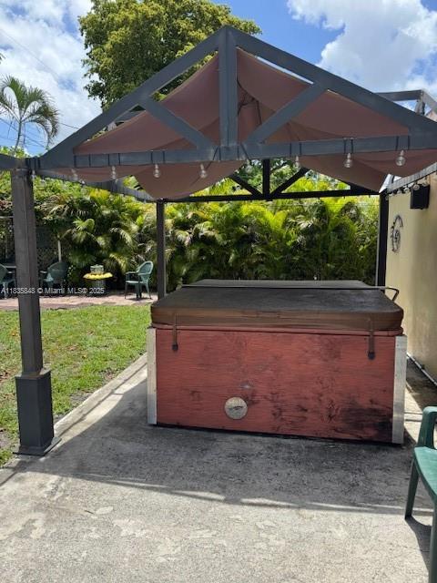 6424 SW 20th St, Miramar, FL 33023 - view of patio featuring a hot tub