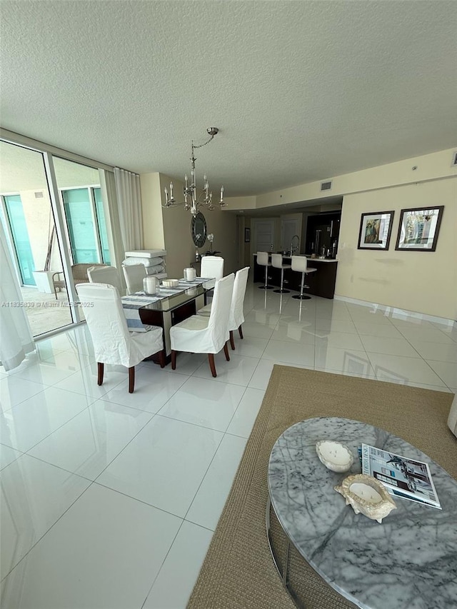 150 Sunny Isles Blvd Unit 1-1401, Sunny Isles Beach, FL 33160 - dining area with a textured ceiling and tile patterned floors