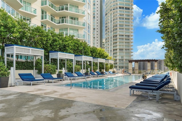 150 Sunny Isles Blvd Unit 1-1401, Sunny Isles Beach, FL 33160 - community pool with a patio area
