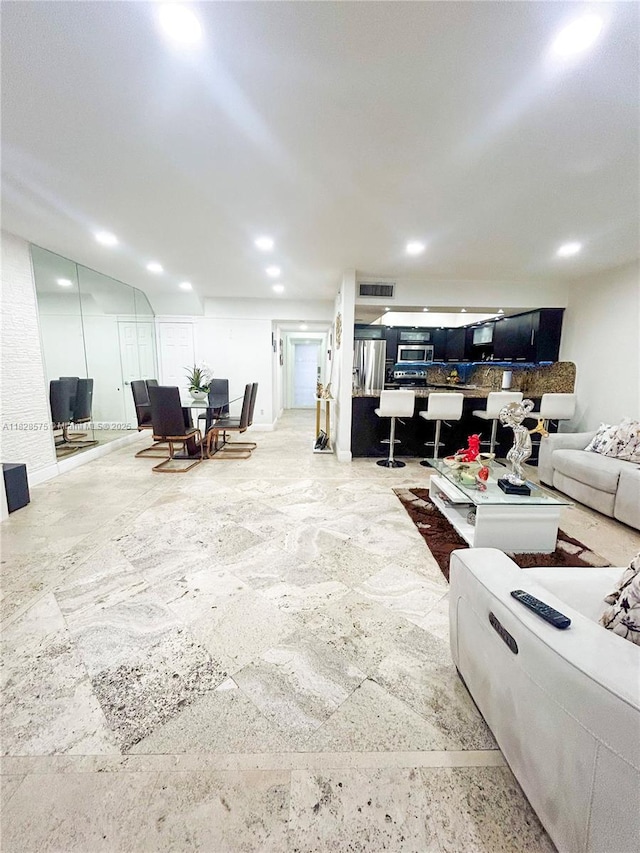 7060 W 2nd Way Unit 7060, Hialeah, FL 33014 - living room with stone finish floors and recessed lighting