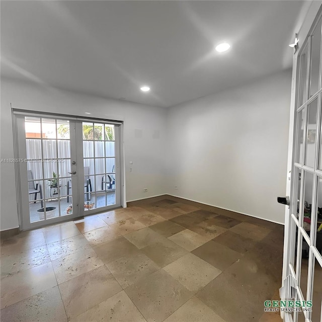 7060 W 2nd Way Unit 7060, Hialeah, FL 33014 - empty room with french doors, stone tile floors, and recessed lighting