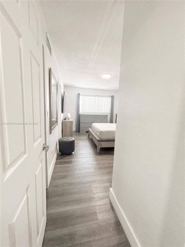 7060 W 2nd Way Unit 7060, Hialeah, FL 33014 - bedroom with wood finished floors and baseboards