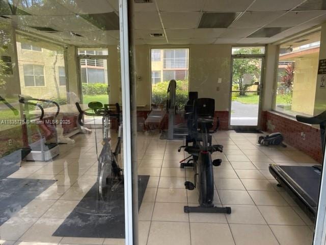 17890 W Dixie Hwy Unit 219, Miami, FL 33160 - workout room with a drop ceiling