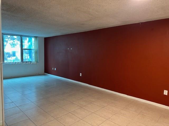 17890 W Dixie Hwy Unit 219, Miami, FL 33160 - empty room featuring a textured ceiling