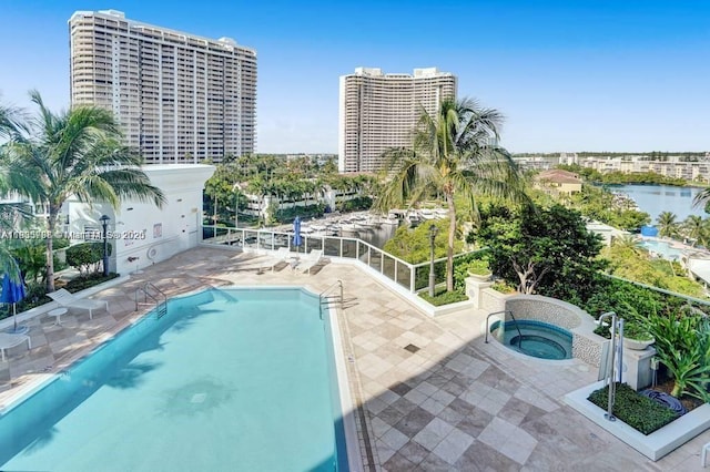4100 Island Blvd Unit 701, Aventura, FL 33160 - community pool featuring a hot tub, a patio, a water view, and a city view