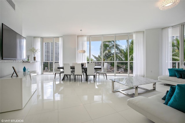 4100 Island Blvd Unit 701, Aventura, FL 33160 - living room featuring a wall of windows, light tile patterned floors, and plenty of natural light