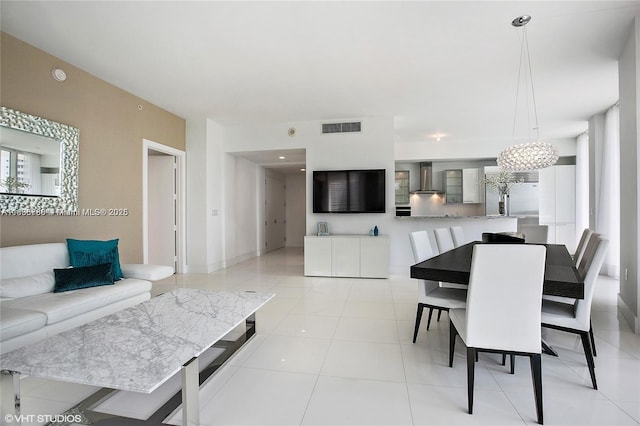 4100 Island Blvd Unit 701, Aventura, FL 33160 - dining room featuring light tile patterned flooring and a chandelier