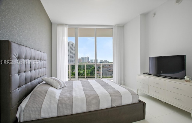 4100 Island Blvd Unit 701, Aventura, FL 33160 - bedroom featuring floor to ceiling windows and light tile patterned floors