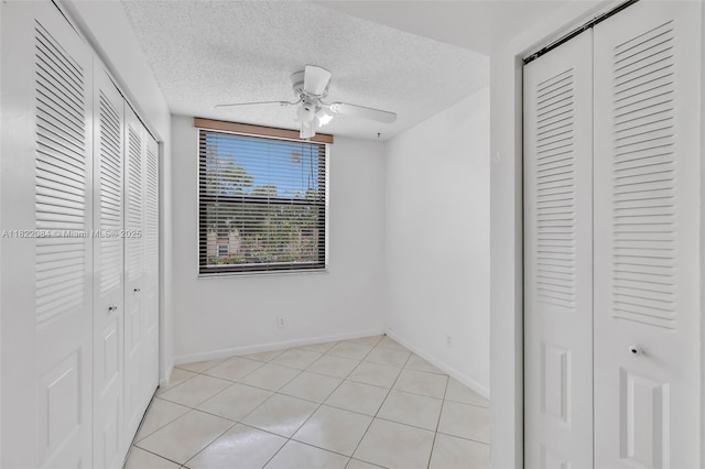 7331 NW 18th St Unit 205, Margate, FL 33063 - unfurnished bedroom with a textured ceiling and ceiling fan