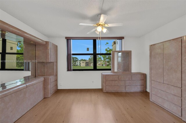 7331 NW 18th St Unit 205, Margate, FL 33063 - unfurnished bedroom featuring light wood finished floors and a ceiling fan