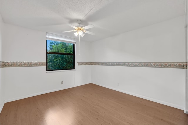 7331 NW 18th St Unit 205, Margate, FL 33063 - unfurnished room featuring wood finished floors, ceiling fan, and a textured ceiling