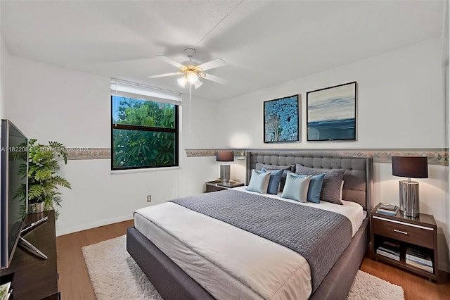 7331 NW 18th St Unit 205, Margate, FL 33063 - bedroom with wood finished floors and a ceiling fan