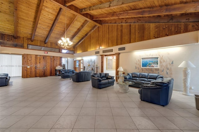 7331 NW 18th St Unit 205, Margate, FL 33063 - living area featuring a wooden ceiling with exposed beams, high vaulted ceiling, a chandelier, light tile patterned floors, and wooden walls