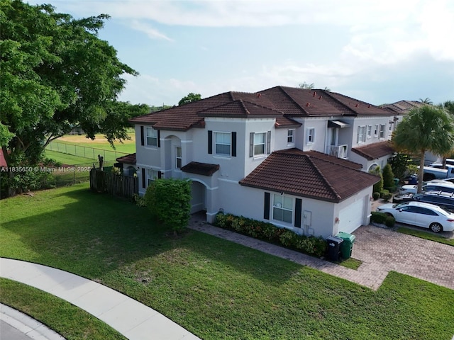 15260 SW 91st Ln, Miami, FL 33196 - mediterranean / spanish-style home featuring an attached garage, a tiled roof, decorative driveway, and stucco siding