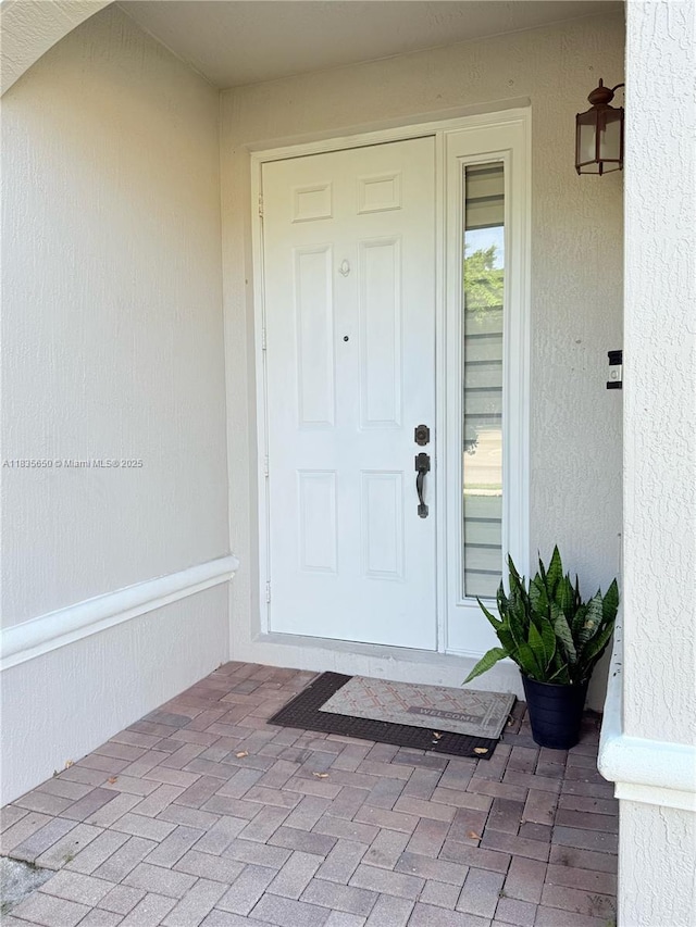 15260 SW 91st Ln, Miami, FL 33196 - doorway to property featuring stucco siding
