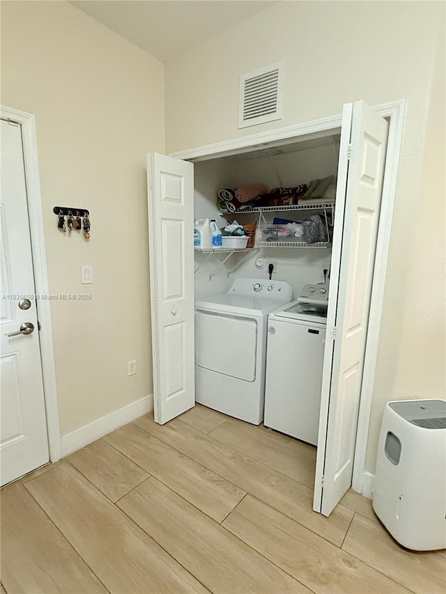15260 SW 91st Ln, Miami, FL 33196 - washroom featuring washer and dryer and light wood-style floors