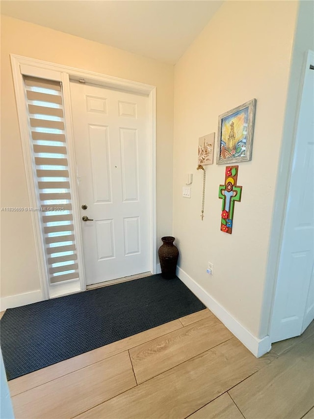 15260 SW 91st Ln, Miami, FL 33196 - foyer featuring wood finished floors and baseboards