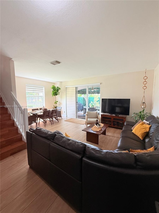 15260 SW 91st Ln, Miami, FL 33196 - living area featuring light wood-style flooring and stairway