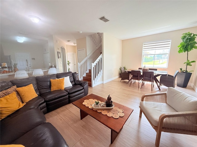 15260 SW 91st Ln, Miami, FL 33196 - living room featuring stairs and light wood-style flooring
