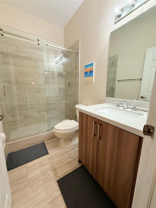 15260 SW 91st Ln, Miami, FL 33196 - bathroom with vanity, a stall shower, and a textured wall