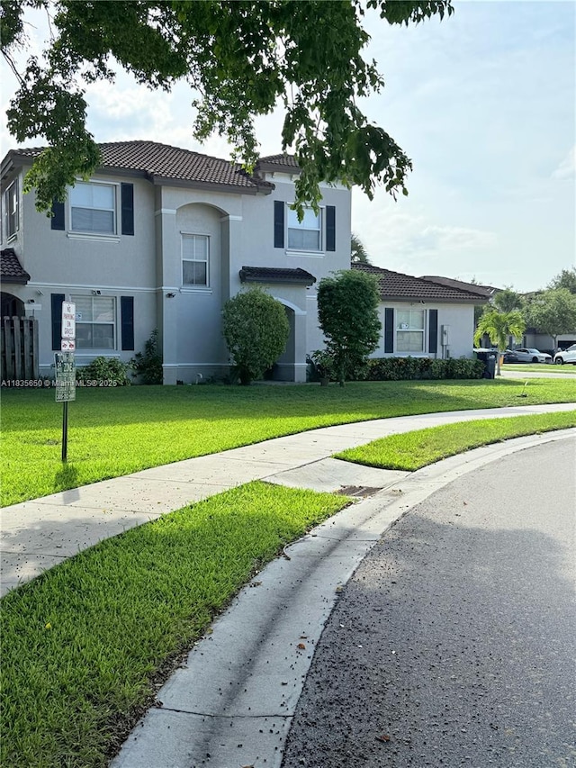 15260 SW 91st Ln, Miami, FL 33196 - view of front of home with stucco siding and a front lawn