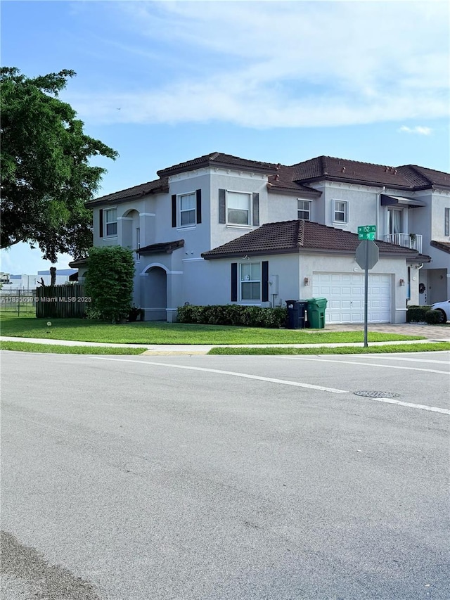 15260 SW 91st Ln, Miami, FL 33196 - townhome / multi-family property featuring stucco siding, a tile roof, driveway, and an attached garage