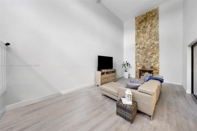 6637 NW 181st Ln, Hialeah, FL 33015 - living area with high vaulted ceiling, light wood finished floors, and a fireplace