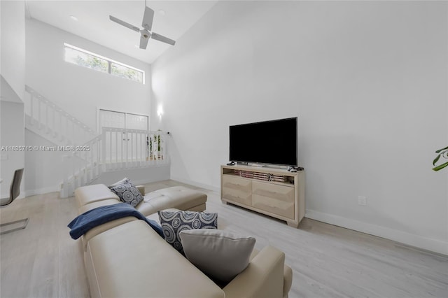 6637 NW 181st Ln, Hialeah, FL 33015 - living area featuring stairs, wood finished floors, high vaulted ceiling, and ceiling fan