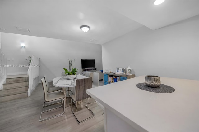 6637 NW 181st Ln, Hialeah, FL 33015 - dining area with light wood finished floors and stairs