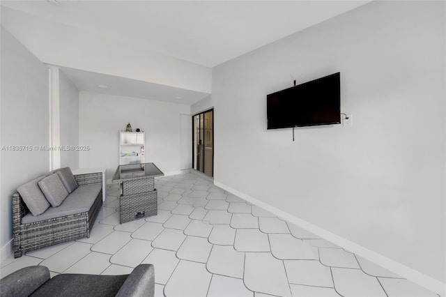 6637 NW 181st Ln, Hialeah, FL 33015 - unfurnished living room with light tile patterned floors and baseboards