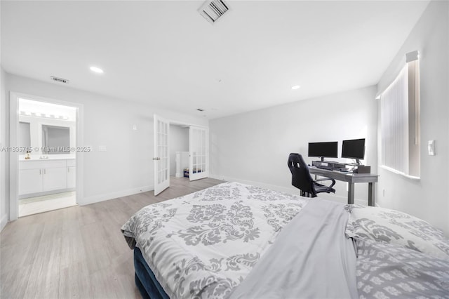 6637 NW 181st Ln, Hialeah, FL 33015 - bedroom featuring french doors, light wood-type flooring, recessed lighting, and ensuite bathroom