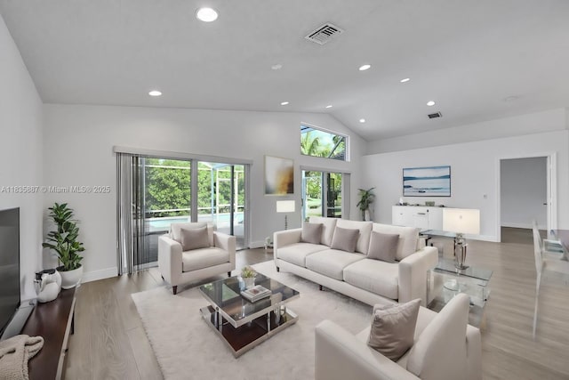 5382 NW 120th Ave, Coral Springs, FL 33076 - living area featuring recessed lighting, wood finished floors, and high vaulted ceiling
