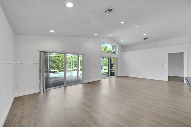 5382 NW 120th Ave, Coral Springs, FL 33076 - unfurnished room with wood finished floors, recessed lighting, high vaulted ceiling, and a textured ceiling
