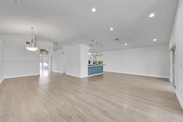 5382 NW 120th Ave, Coral Springs, FL 33076 - unfurnished living room with light wood-style flooring, recessed lighting, and lofted ceiling