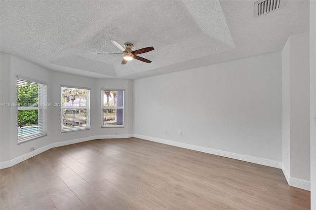 5382 NW 120th Ave, Coral Springs, FL 33076 - unfurnished room featuring a textured ceiling, a ceiling fan, and wood finished floors