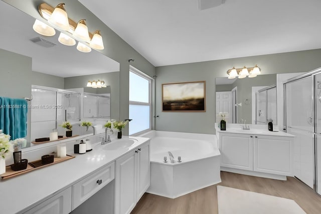 5382 NW 120th Ave, Coral Springs, FL 33076 - full bath featuring wood finished floors, a stall shower, and two vanities