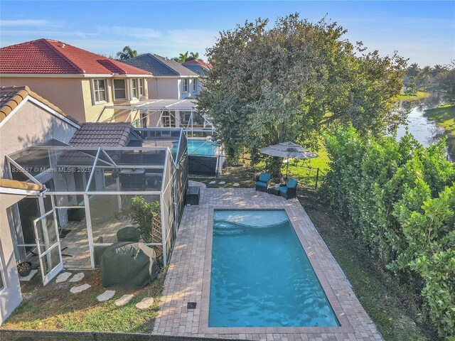 5382 NW 120th Ave, Coral Springs, FL 33076 - swimming pool featuring a fenced backyard and a water view