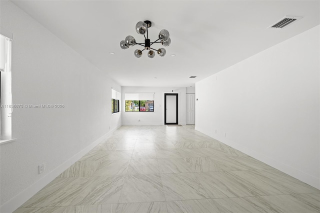 500 NW 7th Ct, Hallandale Beach, FL 33009 - spare room featuring a chandelier and baseboards