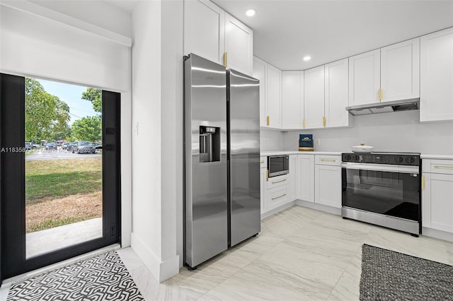 500 NW 7th Ct, Hallandale Beach, FL 33009 - kitchen with appliances with stainless steel finishes, under cabinet range hood, white cabinets, light countertops, and recessed lighting