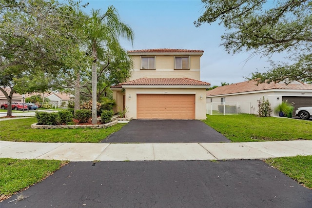 1326 Majesty Ter, Weston, FL 33327 - mediterranean / spanish home with stucco siding, asphalt driveway, a tile roof, and an attached garage
